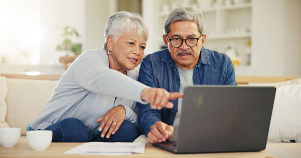 Retired couple reviewing how to put home equity to work