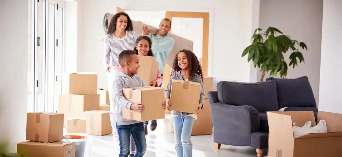 Family with moving boxes in their home